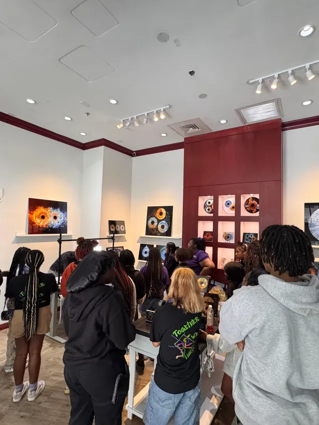 Students at the SCIO iris photography booth on a school trip